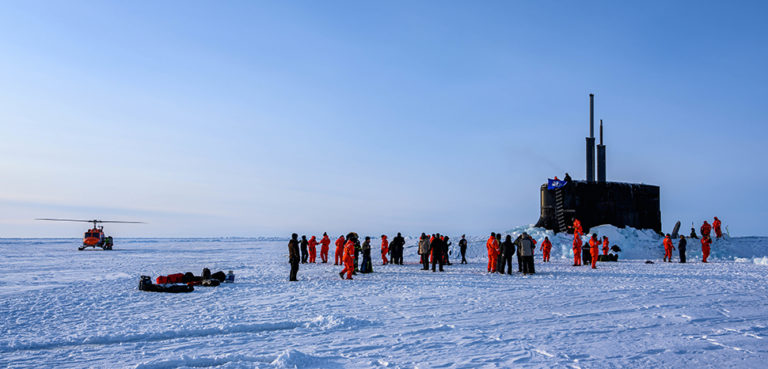 The crew of USS Connecticut (SSN 22) enjoys ice liberty after surfacing in the Arctic Circle during Ice Exercise (ICEX) 2020. BEAUFORT SEA, Arctic Circle (Mar. 07, 2020) -- The crew of the Seawolf-class fast-attack submarine, USS Connecticut (SSN 22), enjoys ice liberty after surfacing in the Arctic Circle during Ice Exercise (ICEX) 2020. ICEX 2020 is a biennial submarine exercise which promotes interoperability between allies and partners to maintain operational readiness and regional stability, while improving capabilities to operate in the Arctic environment. (U.S. Navy photo by Mass Communication Specialist 1st Class Michael B. Zingaro/Released)200307-N-KB401-1003; cc Official US Navy Page, modified, Flickr