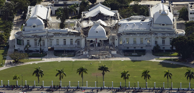 Logan Abassi / UNDP Global - United Nations Development Programme, originally posted to Flickr as Haiti Earthquake, https://en.wikipedia.org/wiki/Port-au-Prince#/media/File:Haitian_national_palace_earthquake.jpg