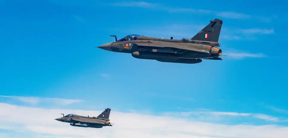 cc Indian Air Force, modified, https://commons.wikimedia.org/w/index.php?search=india%20air%20force&ns0=1&ns6=1&ns12=1&ns14=1&ns100=1&ns106=1#/media/File:HAL_Tejas_of_India_Air_Force_Squadron_18_Flying_Bullets.jpg