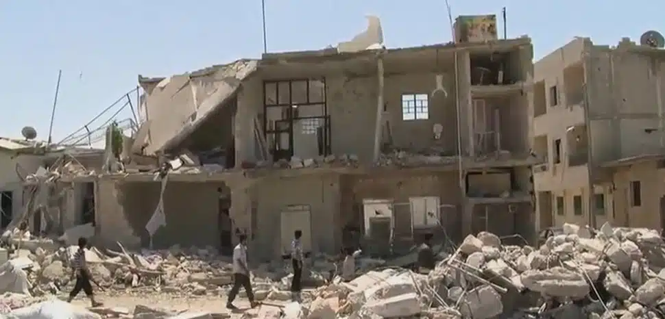                 cc VOA, modified, https://commons.wikimedia.org/wiki/File:Azaz_Syria_during_the_Syrian_Civil_War_Missing_front_of_House.jpg
              