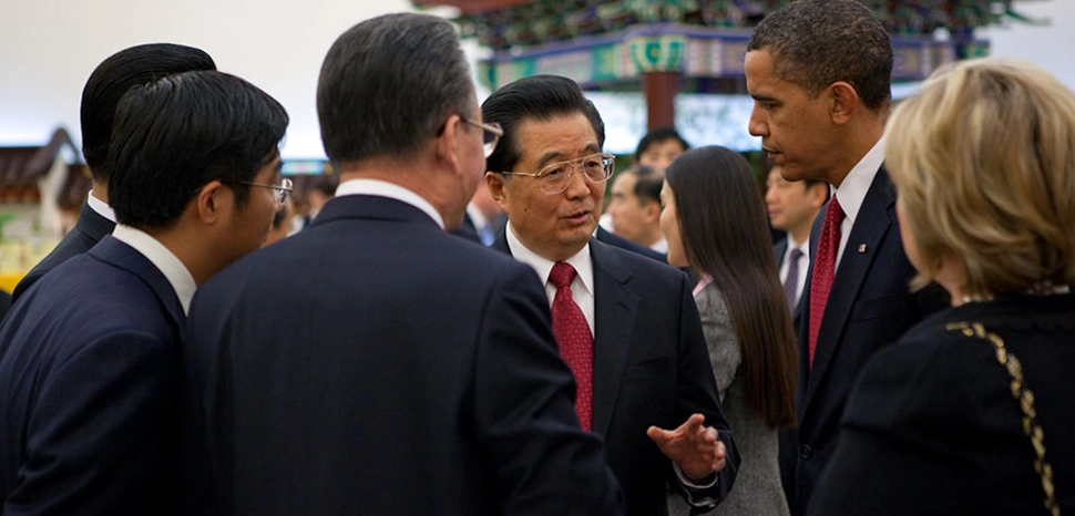 cc Obama White House, modified, https://obamawhitehouse.archives.gov/blog/2009/11/17/us-and-china-towards-a-clean-energy-economy/ - President Barack Obama and President Hu Jintao together at a reception before the formal state dinner at Great Hall of the People in Beijing, China on Nov. 17, 2009. (Official White House photo by Pete Souza) November 17, 2009. (Official White House Photo by Pete Souza)