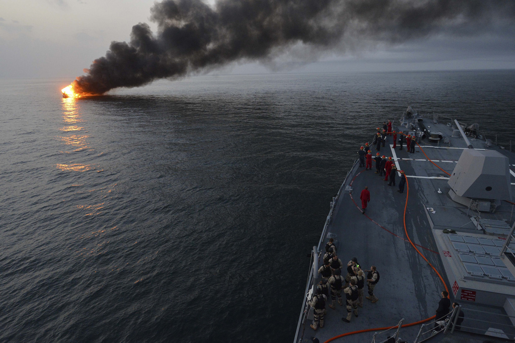 U.S. Sailors aboard the guided missile destroyer USS William P. Lawrence (DDG 110) prepare to offer rescue assistance to a burning vessel March 11, 2013, during a transit in the Strait of Hormuz. The William P. Lawrence was deployed to the U.S. 5th Fleet area of responsibility to promote maritime security operations, theater security cooperation efforts and support missions for Operation Enduring Freedom. - https://commons.wikimedia.org/wiki/File:Sailors_aboard_the_guided-missile_destroyer_USS_William_P._Lawrence_(DDG_110)_prepare_to_offer_rescue_assistance_to_a_burning_vessel_during_a_transit_of_the_Strait_of_Hormuz_on_March_11,_2013_130311-N-ZQ631-124.jpg