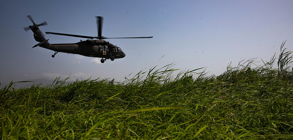 A UH-60 helicopter from the Puerto Rico Army National Guard Aviation departs Port-au-Prince Airport, Haiti, Aug. 24, 2021. Guardsmen from the Puerto Rico Army National Guard Aviation have been assisting in the aid-relief efforts in the country since Aug. 17. (Army National Guard photo by Sgt. Agustin Montanez/Released)